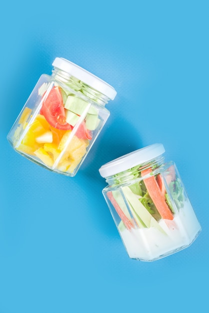 Healthy vegetable salad in jars