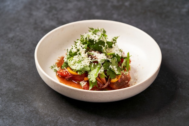 Healthy vegetable salad with grated cheese, close-up