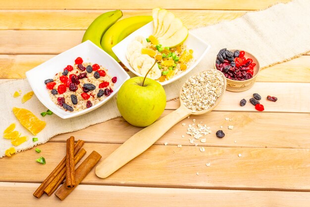 Healthy vegetarian breakfast with oatmeal and fruits