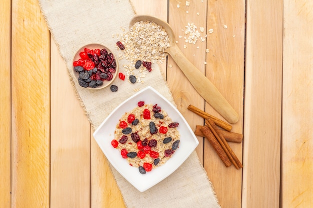 Healthy vegetarian breakfast with oatmeal and fruits