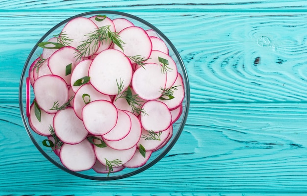 Healthy vegetarian radish salad with green onion and dill food bsckground