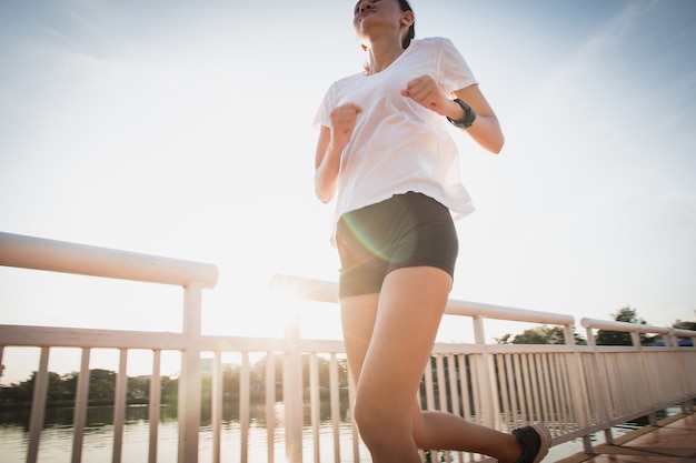 Healthy woman doing exercises and warm up before running