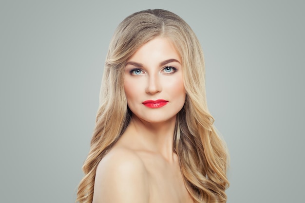 Healthy woman with long blonde hair and clear skin Facial treatment and cosmetology