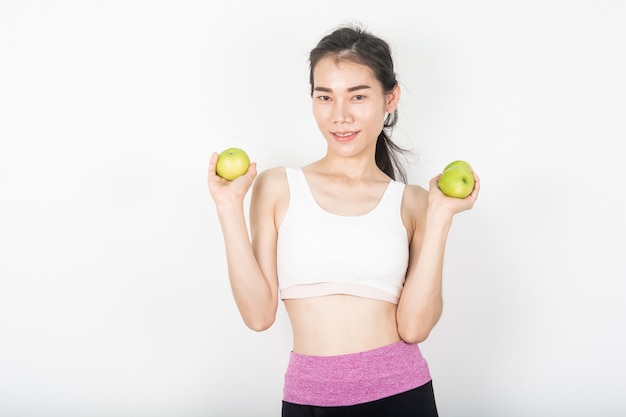 Healthy women with green apples in the white scene