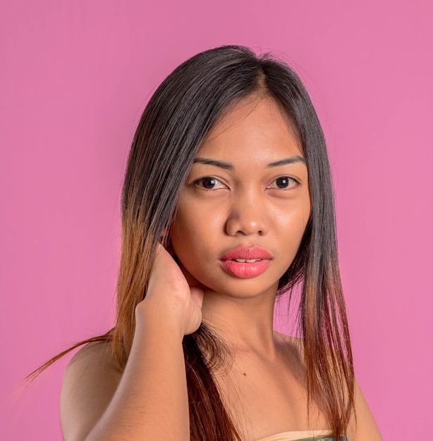Healthy young asian latin woman Female different emotionson over a pink background