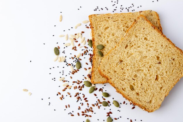 Healty tasty multigrain bread with pumpkin chia flax seeds on white background