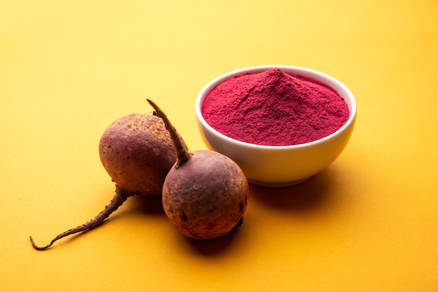 Heap of Beetroot or Beet Root powder with raw whole contains the essential minerals iron, potassium, and magnesium