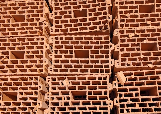 Heap of bricks. On construction of building.