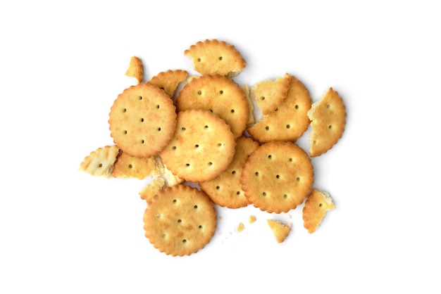 Photo heap of broken crackers isolated on white background. top view.