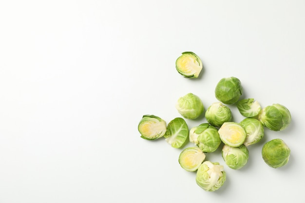 Heap of brussels sprout on white surface