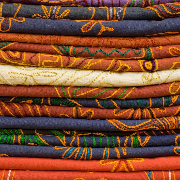 Heap of cloth fabrics at a local market in India Close up