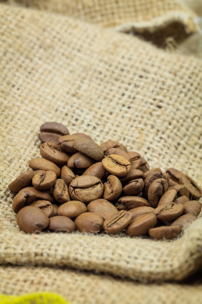 Heap of coffee beans on sackcloth