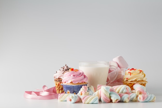 Heap of colored sweets on white space