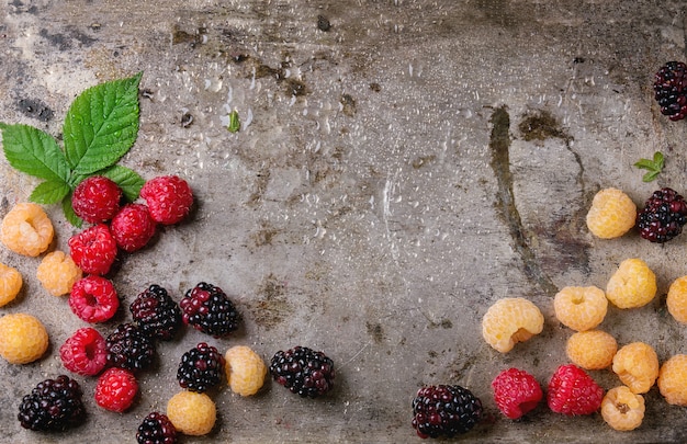 Heap of colorful raspberries 