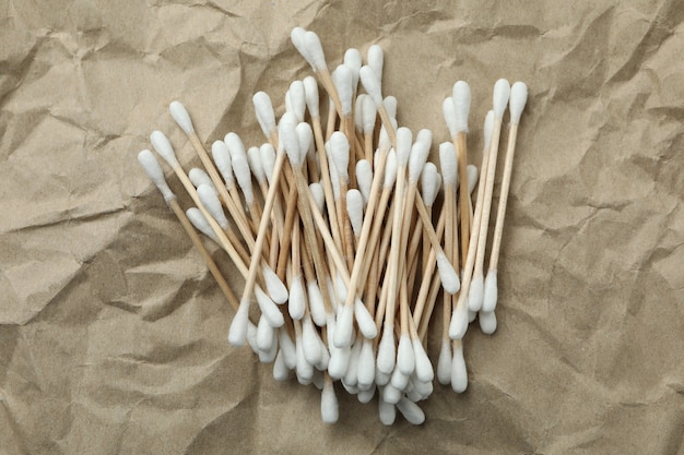 Heap of cotton swabs on craft paper background