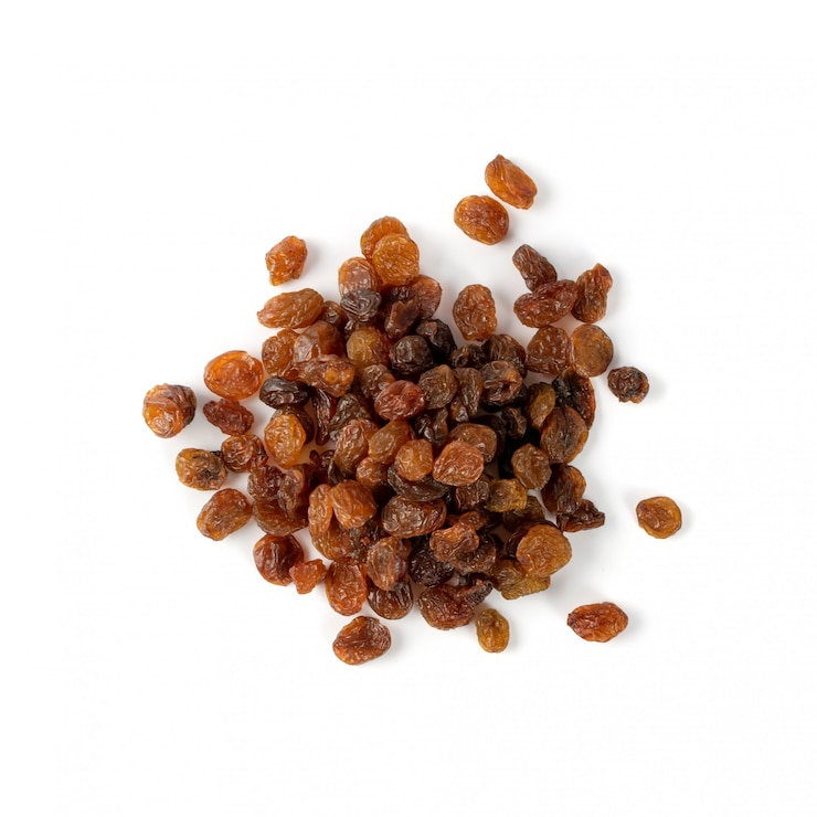 Photo heap of dark brown sweet raisins, dried grapes pile