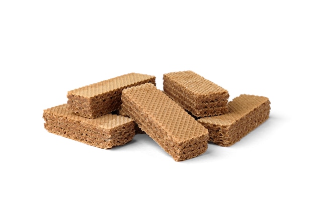 Heap of dark wafer biscuits isolated on white background.