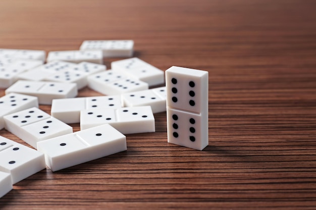 Heap of dominoes on wooden background