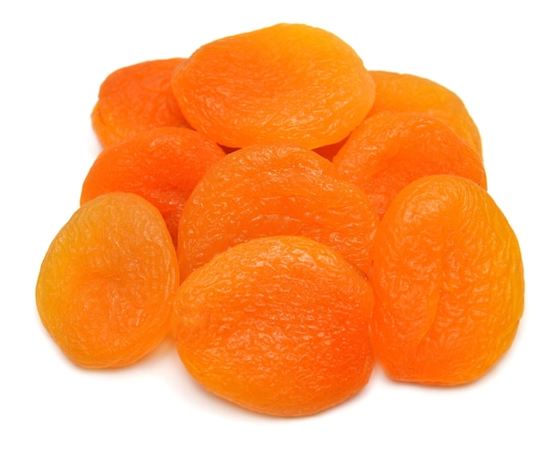 Heap of dried apricots fruit isolated on white background Perfectly retouched full depth of field on the photo Top view flat lay