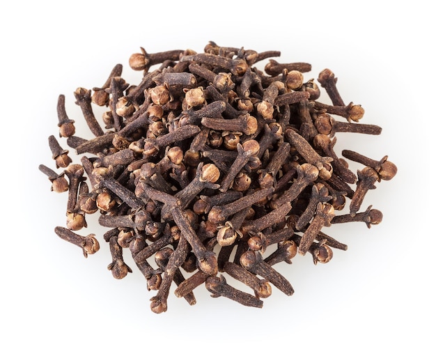 Heap of dried cloves isolated on white background