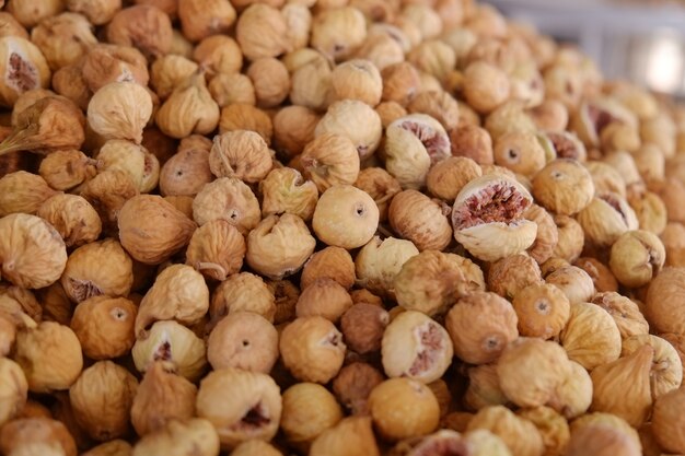 Heap dried figs sell in a nuts and dried fruits shop.