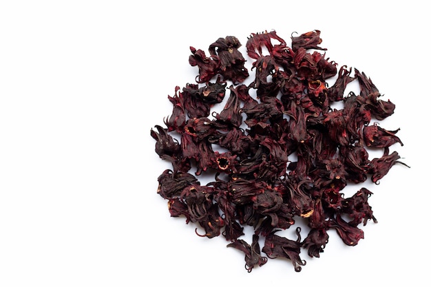 Heap of dried roselle flower isolated on white. Top view