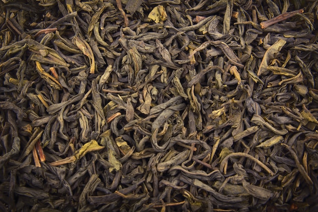 Куча сухого зеленого чая (текстура)