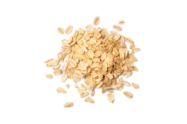 Heap of dry rolled oats isolated