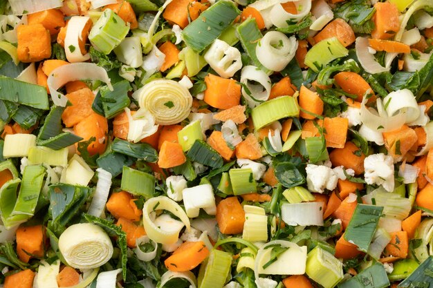 Heap of fresh cut organic vegetables in Dutch called soepgroentefull frame close up