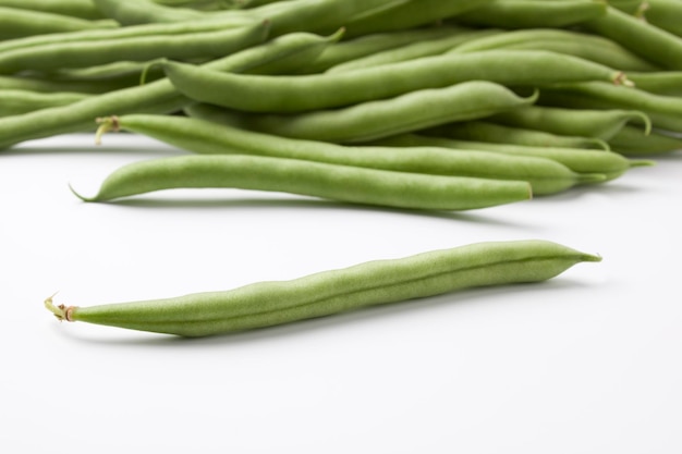 Heap of fresh raw Green beans or French beans on white background