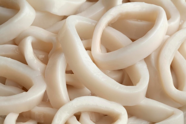 Heap of fresh raw squid rings full frame