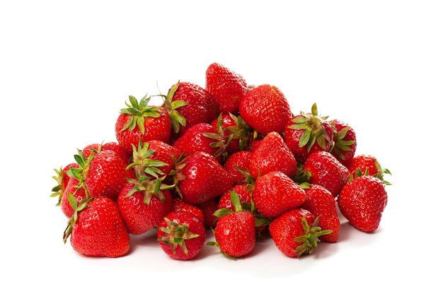 Heap of fresh red ripe strawberries isolated on white