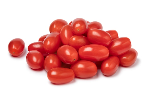 Heap of fresh small red sweet snack tomatoes on white background