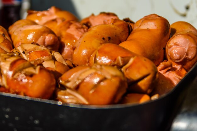 Heap of the fried sausages in steel tray