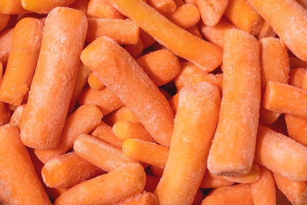 Heap of frozen baby carrot. Food background