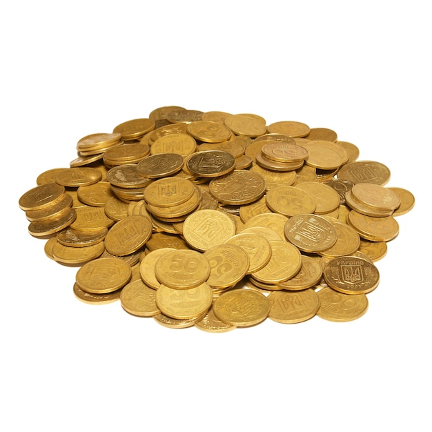 Heap of golden coins isolated on white.