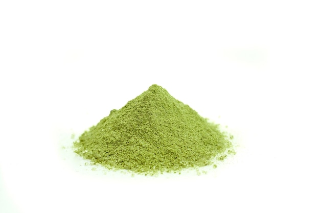 Heap of green matcha powder in isolated white background