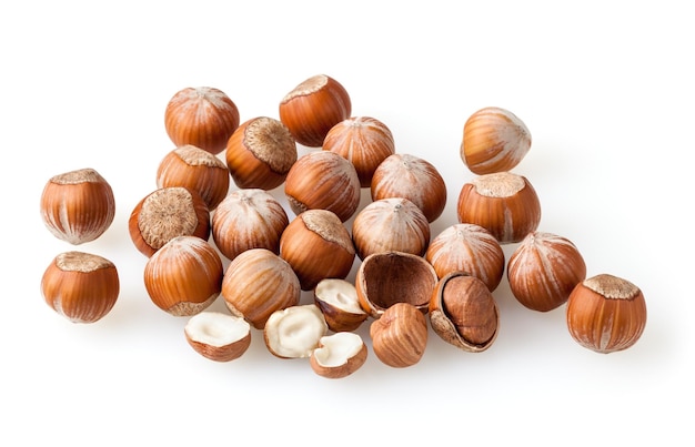 Heap of hazelnuts isolated on white background