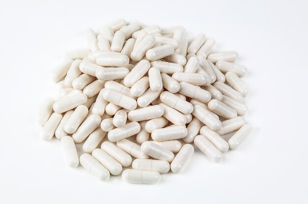 Heap of medical pills on white background