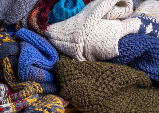 Heap of multicolored knitted warm soft things