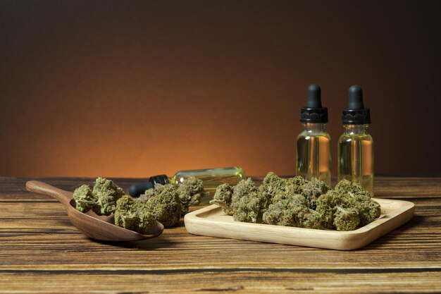 Photo heap of organic marijuana buds with hemp oil