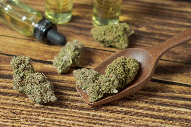 Heap of Organic Marijuana buds with hemp oil