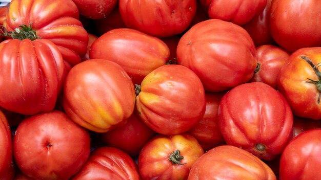 Heap of organic tomatoes on  market