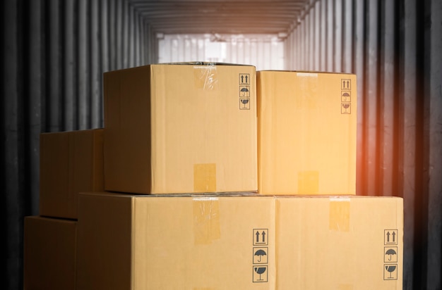 Heap of package boxes load inside cargo shipping container  delivery truck transportation