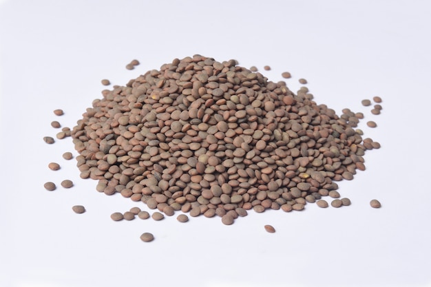 Heap of pardina lentils on white background