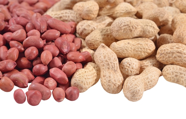 Heap of peanuts on a white background