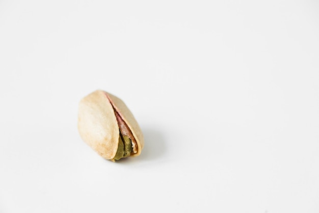 Heap of pistachios isolated on white background Overhead