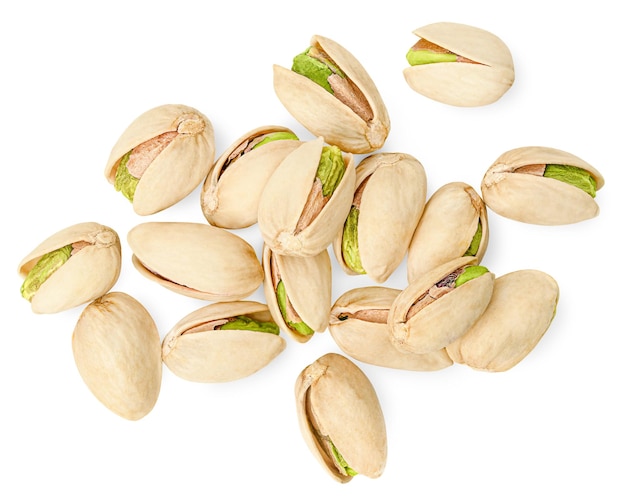 Heap of pistachios on a white isolated background top view