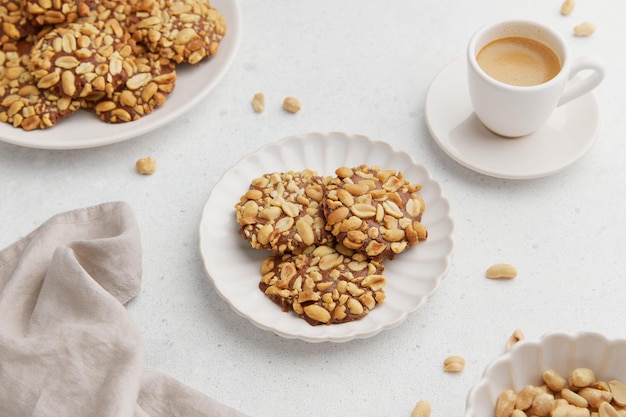 A heap of portugues traditional peanut cookies known as bolachas de amendoim on the white plate