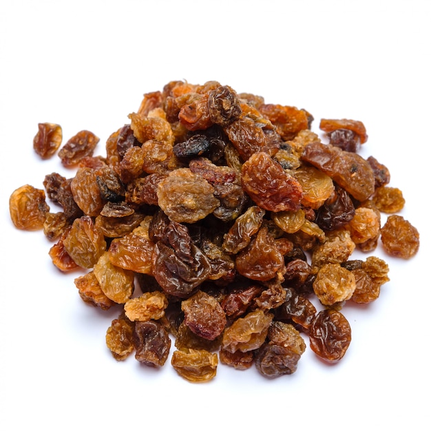 Heap of raisins on white table